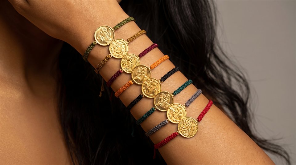 Cord bracelets with round gold medallions engraved with turtle, saurian and serpent
